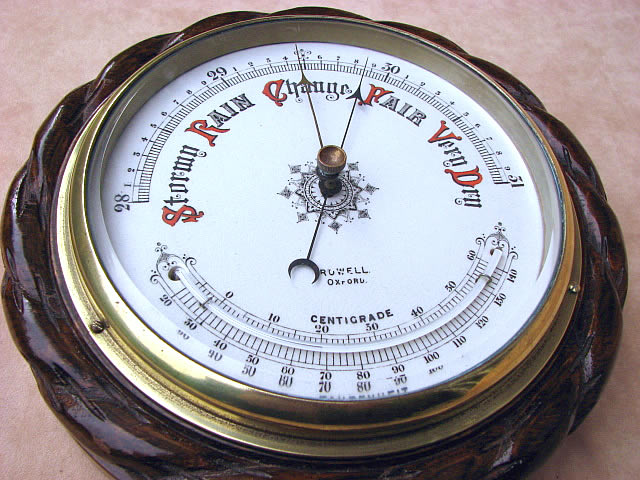 Oak cased aneroid barometer with ceramic dial & curved thermometer